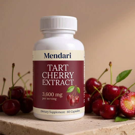 Mendari Tart Cherry Extract — white supplement bottle with deep cherry-maroon label, staged with fresh dark tart cherries on a warm stone surface
